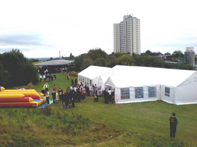 Village event with marquees and inflatable games