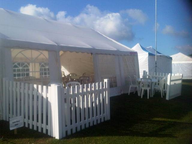 Marquee with white picket fence surrounding