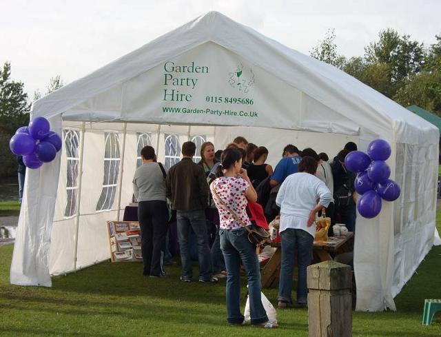 Open marquee with Garden Party Hire branding