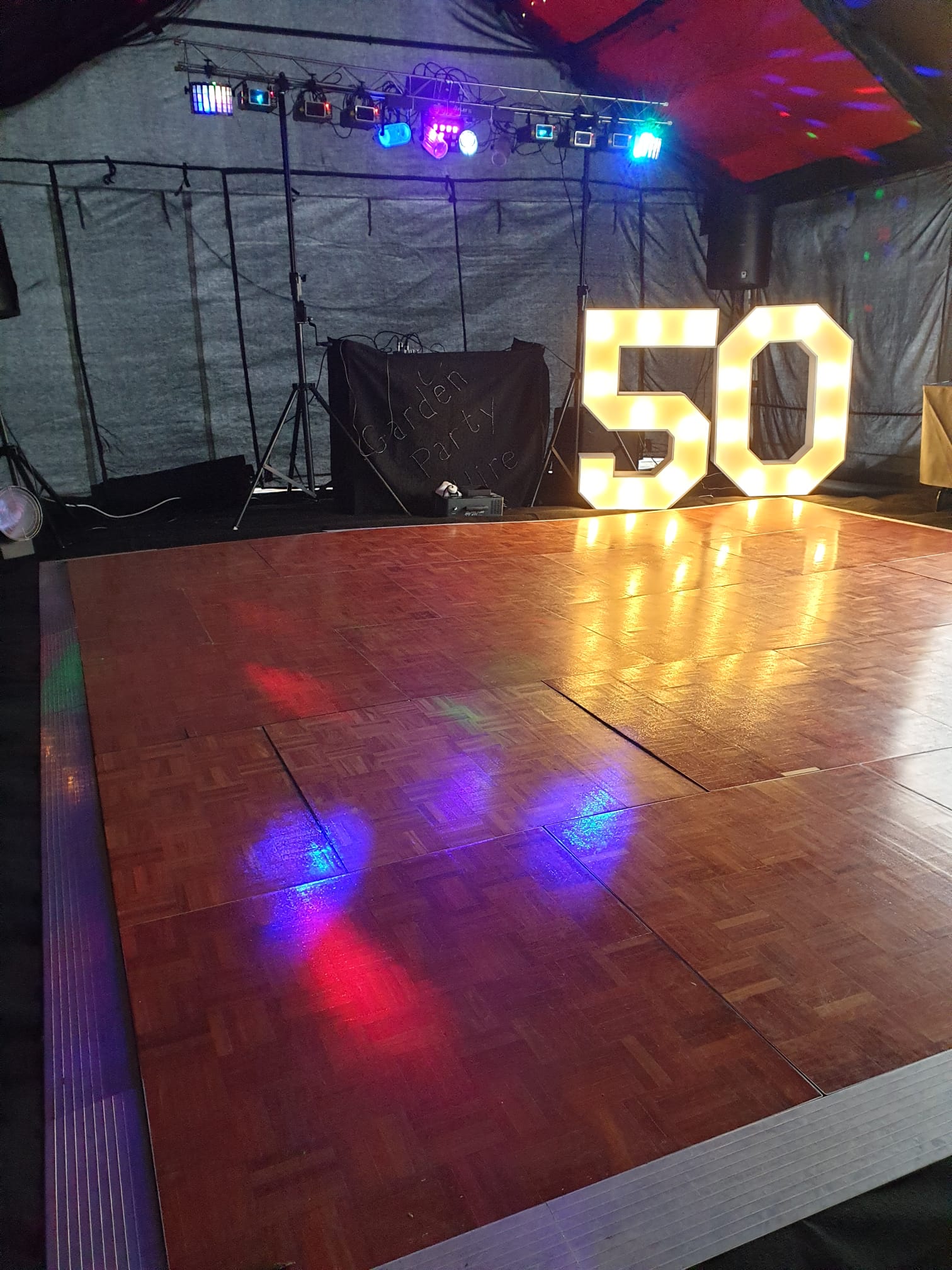 50th birthday party in a marquee with full disco rig, lights, lasers and dance floor