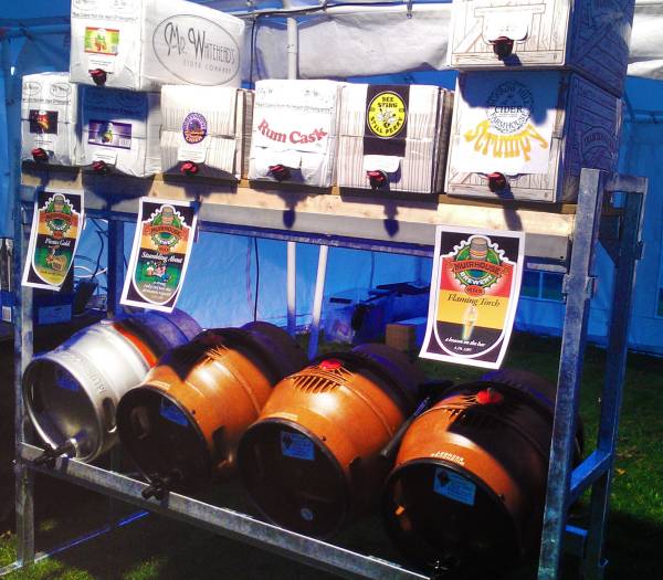 Real ale and real cider kegs on a shelf