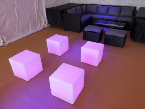 Four pink LED colour changing seating cubes
