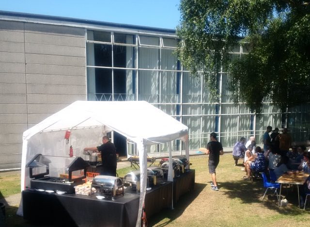 BBQ set up with chafing dishes under a marquee