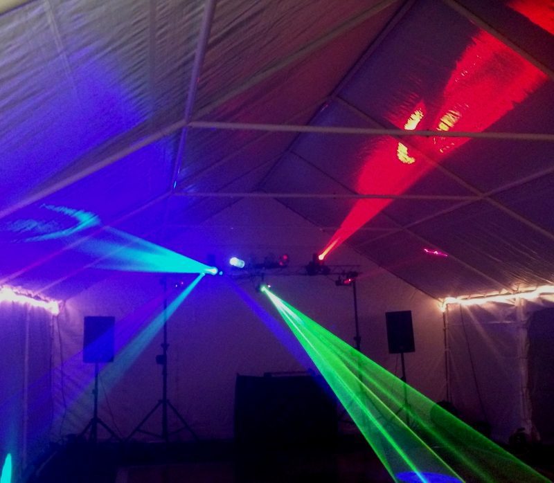 Blue, red and green disco lights in a marquee