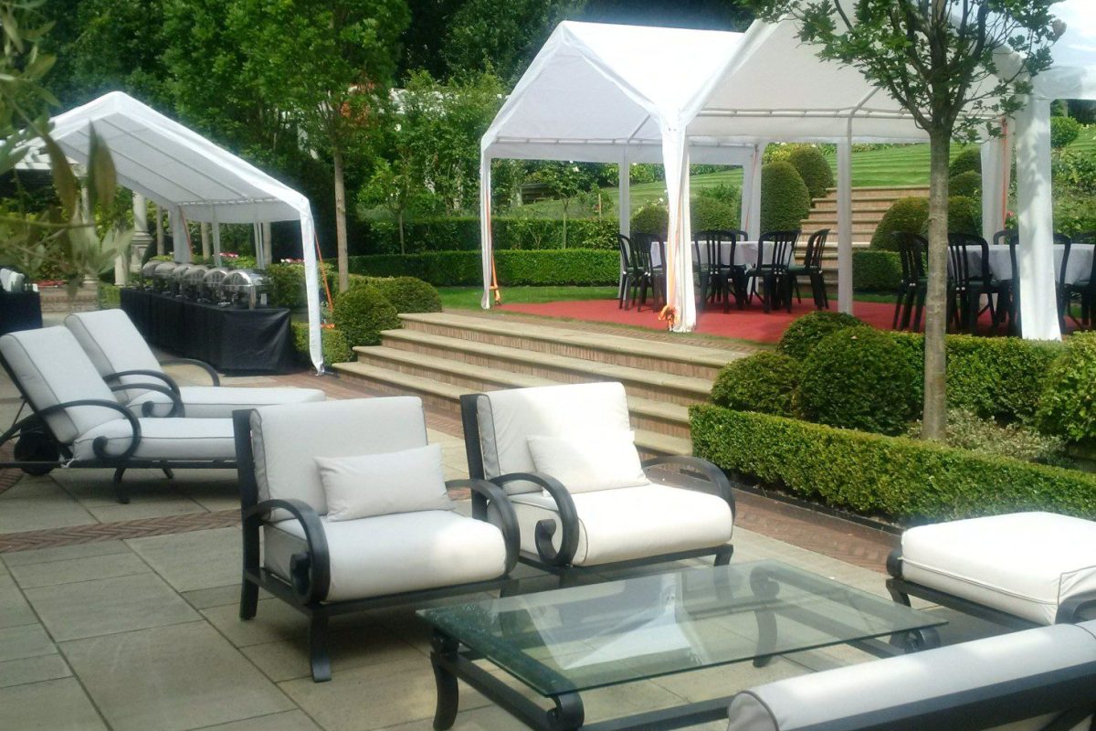 Marquees set up on a well kept mansion garden